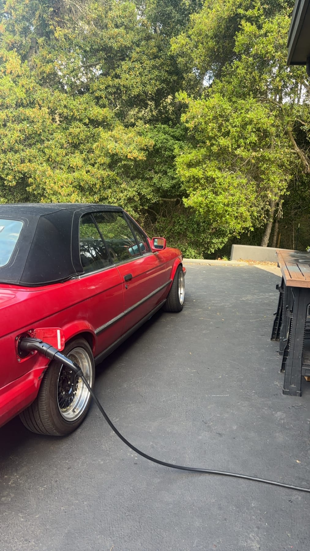 The electric E30 connected to a J1772 charger